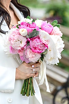 Bride Holding a Bouquet with Peonies