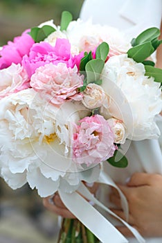 Bride Holding a Bouquet with Peonies