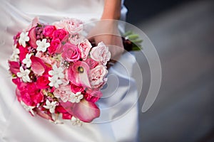 Bride holding bouquet of pink and white flowers