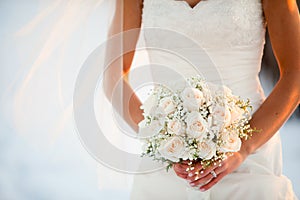 Bride Holding bouquet of white flowers