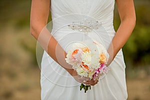 Bride holding bouquet of white flowers