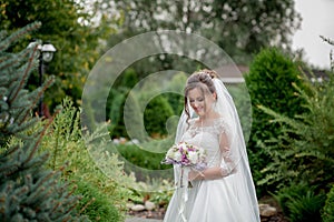 Bride holding colorful elegant modern autumn wedding bouquet. The concept of lifestyle and wedding