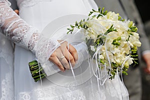 Bride holding freesia flowers