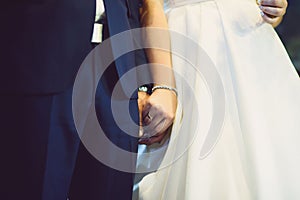 Bride Holding Groom`s Hand