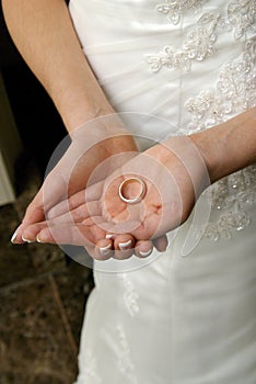 Bride holding her wedding ring