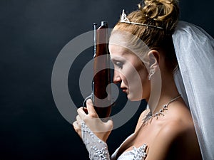 Bride holding old gun