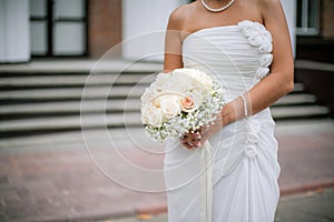 Bride holding wedding bouquet