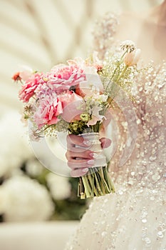 Bride holding the wedding bouquet, Detail image cut