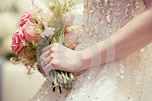 Bride holding the wedding bouquet, Detail image cut