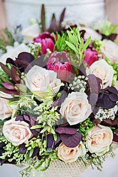 Bride holding wedding bouquet in studio