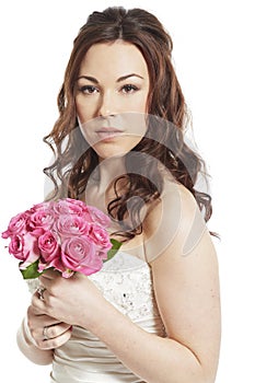 Bride holding a wedding bouquet thoughtful