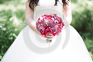 Bride holding wedding bouquet on wedding ceremony