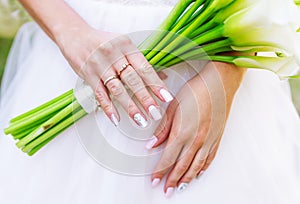 Bride holding white calla lily wedding bouquet