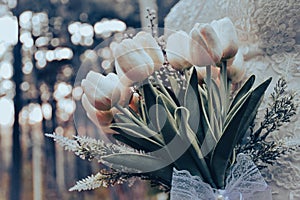 Bride holding white elegant modern autumn wedding bouquet.