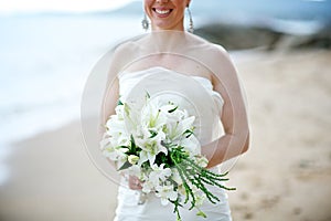 Bride holding white wedding bouquet