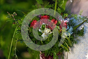 The bride holds a wedding bouquet in her hands, wedding day flowers