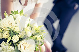 Bride holds a wedding bouquet - wedding daydetail