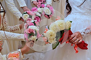 Bride holds a wedding bouquet, wedding dress, wedding details