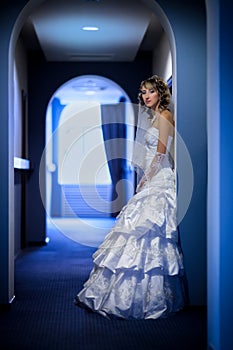 Bride at hotel corridor