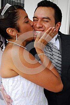 Bride kisses her groom