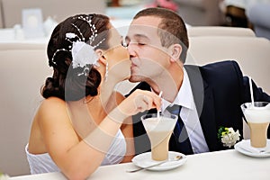 Bride kissing groom