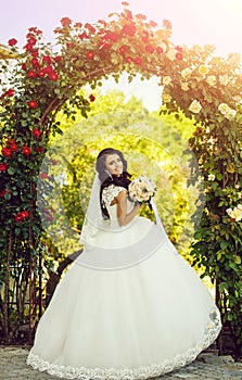 Bride with long brunette hair with flower.