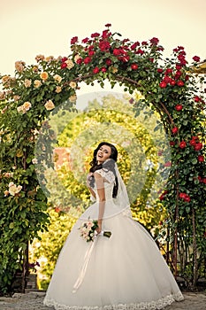 Bride with long brunette hair with flower.