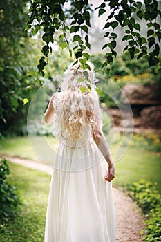 Bride with long fair hair from back