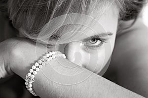 Bride looking fro behind her arm