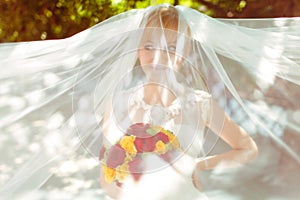 Bride looks funny hidden under a veil