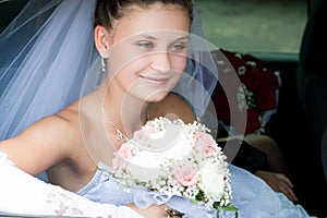 Bride looks out of the car