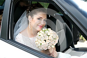 Bride in luxury car