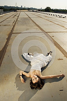 Bride lying on the road