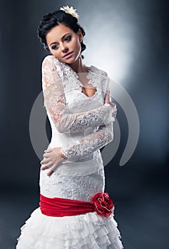 Bride model with red ribbon and bow.