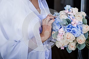 Bride in the morning in a negligee at the wedding