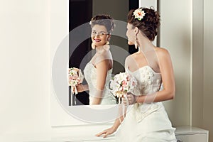 Bride near mirror