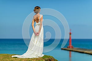 A bride near the ocean