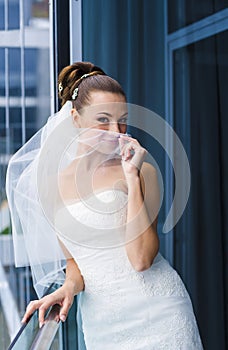 Bride near the window.