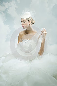 Bride over the sky background. Vintage style.