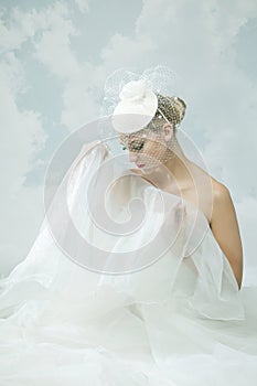 Bride over the sky background. Vintage style.