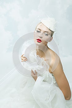 Bride over the sky background. Vintage style.