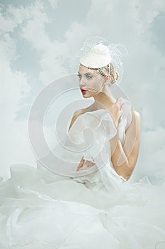 Bride over the sky background. Vintage style.
