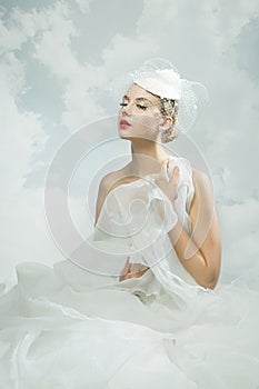 Bride over the sky background. Vintage style.