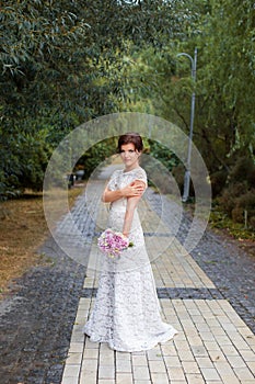 Bride in the park in the alley