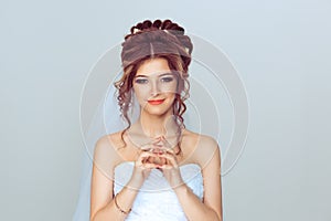 Bride plotting. Closeup portrait sneaky, sly, scheming young woman plotting revenge plan, prankster  on light blue wall