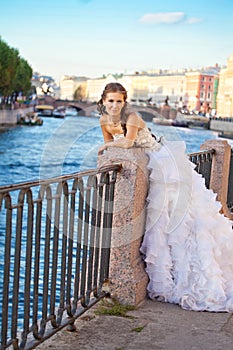 Bride posing outdoor near the river