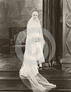 Bride posing on top of steps