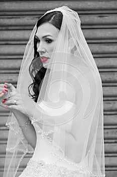A bride with red lips and red nails
