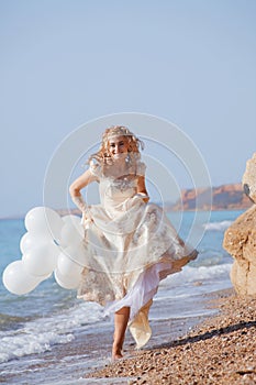 Bride running on beach