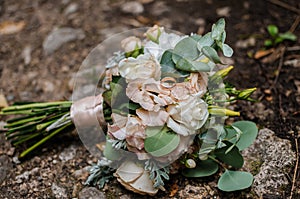 the bride's beckett with wedding rings lies on the road